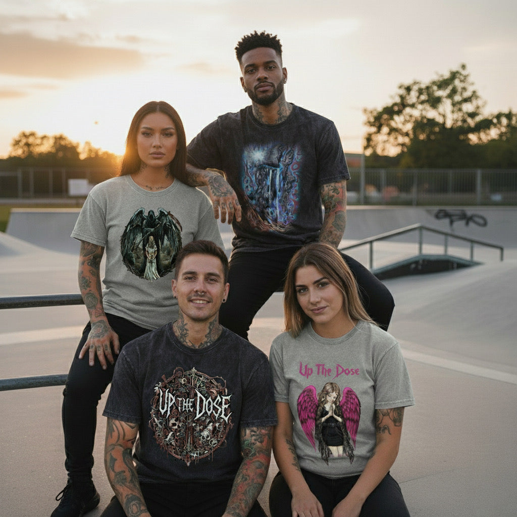 Four people wearing 'Up The Dose' t-shirts at a skate park.
